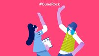 Cartoon of a woman and young man doing a high five legend: Gums Rock