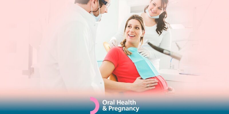 Pregnant woman with health professionals